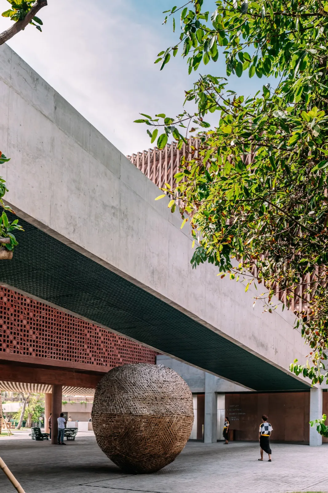 Woven sphere installation by BYO Living under a timber canopy